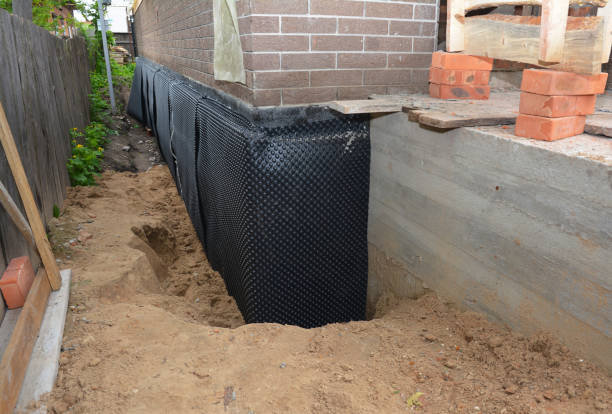 Happy homeowners after waterproofing job in Canaan